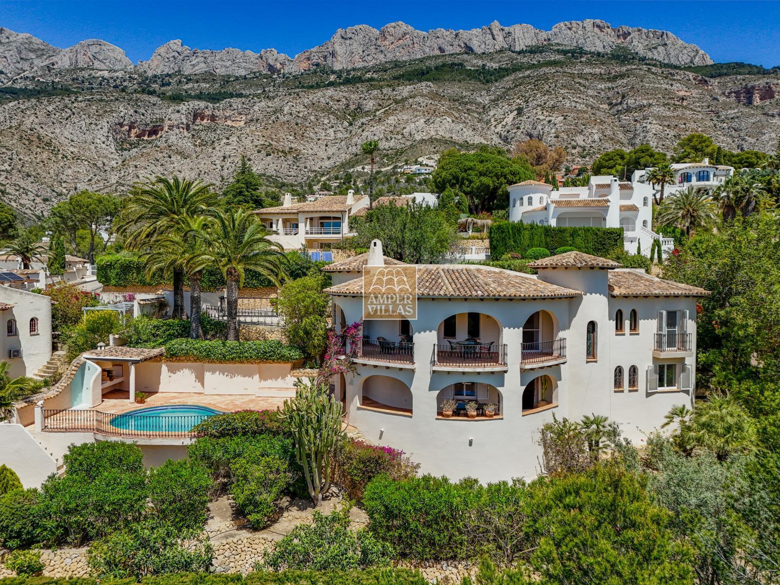 A beautiful villa in a peaceful, green setting.