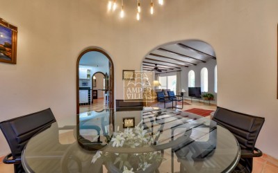 A beautiful villa in a peaceful, green setting.