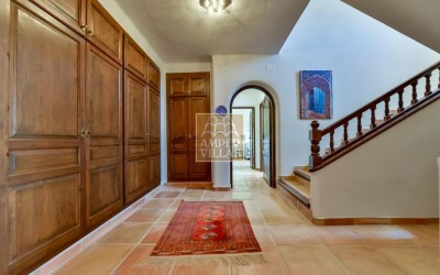 A beautiful villa in a peaceful, green setting.