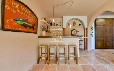 A beautiful villa in a peaceful, green setting.