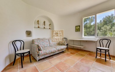 A beautiful villa in a peaceful, green setting.