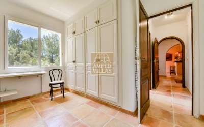 A beautiful villa in a peaceful, green setting.